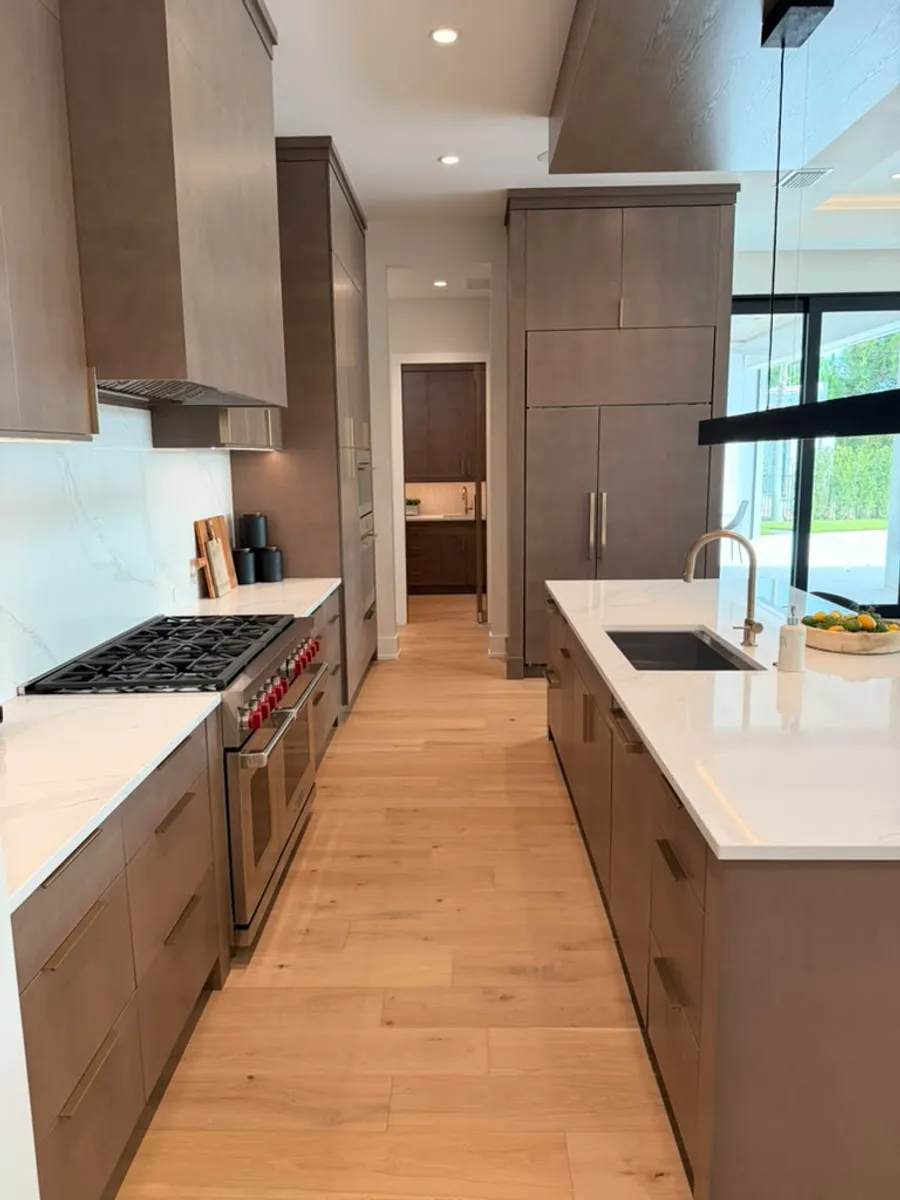 Galley kitchen finished with engineered wood flooring