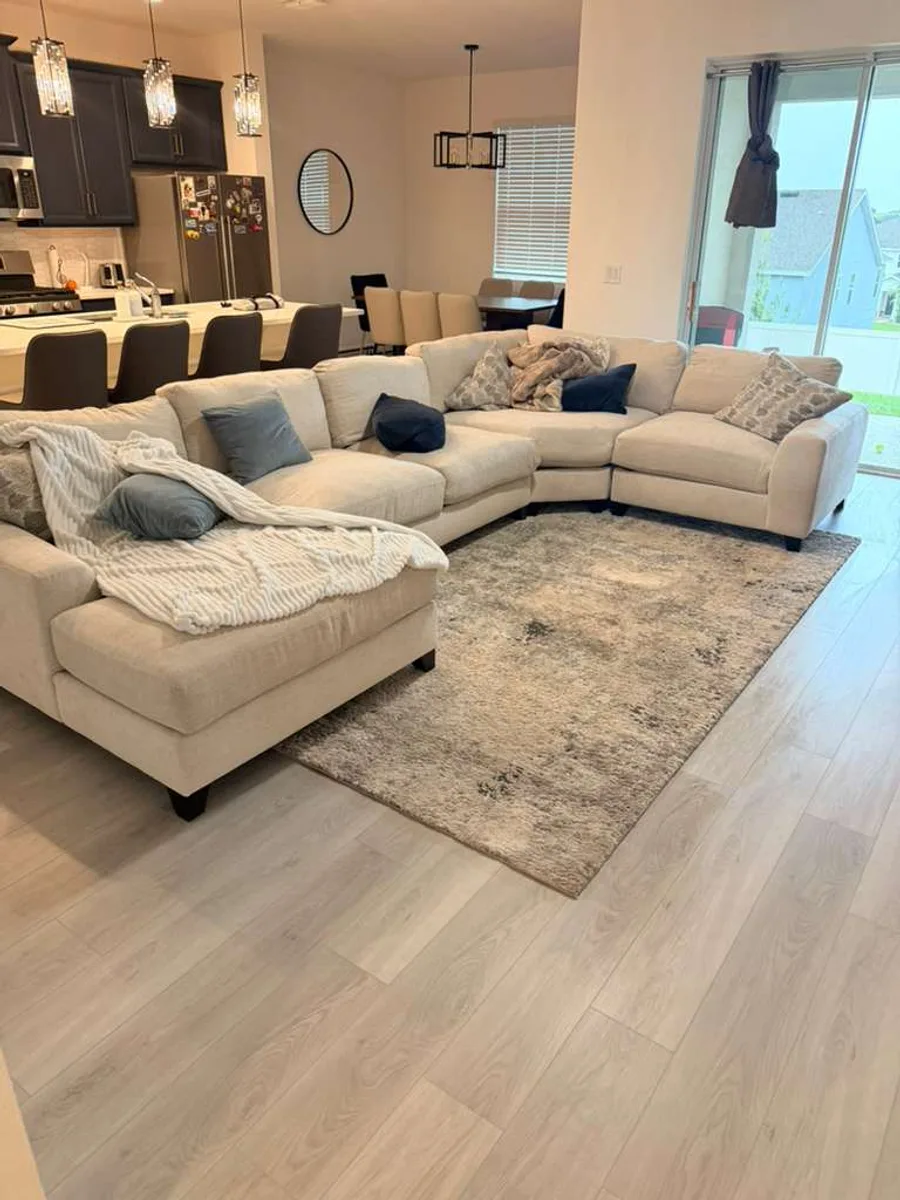 Living room finished with light wood-look flooring