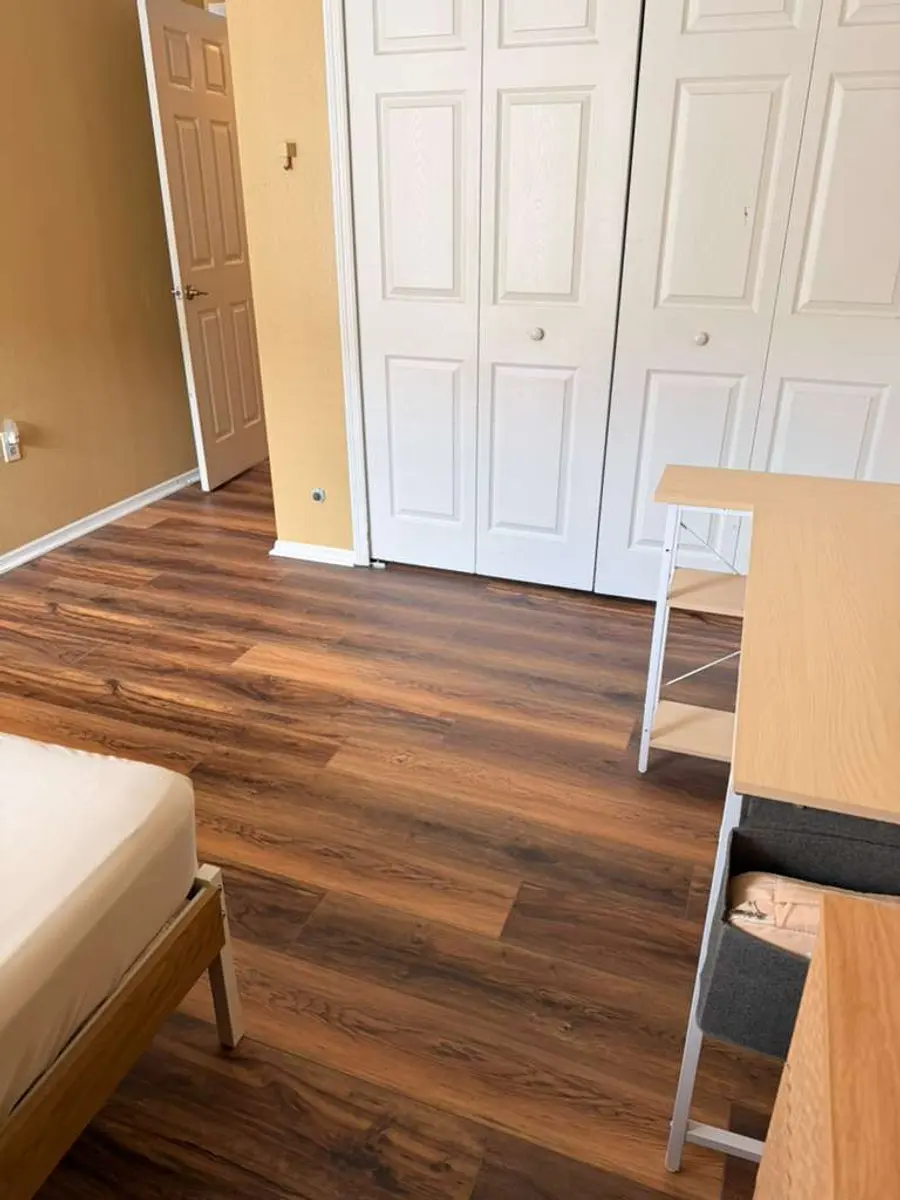 Bedroom finished with wood-look flooring