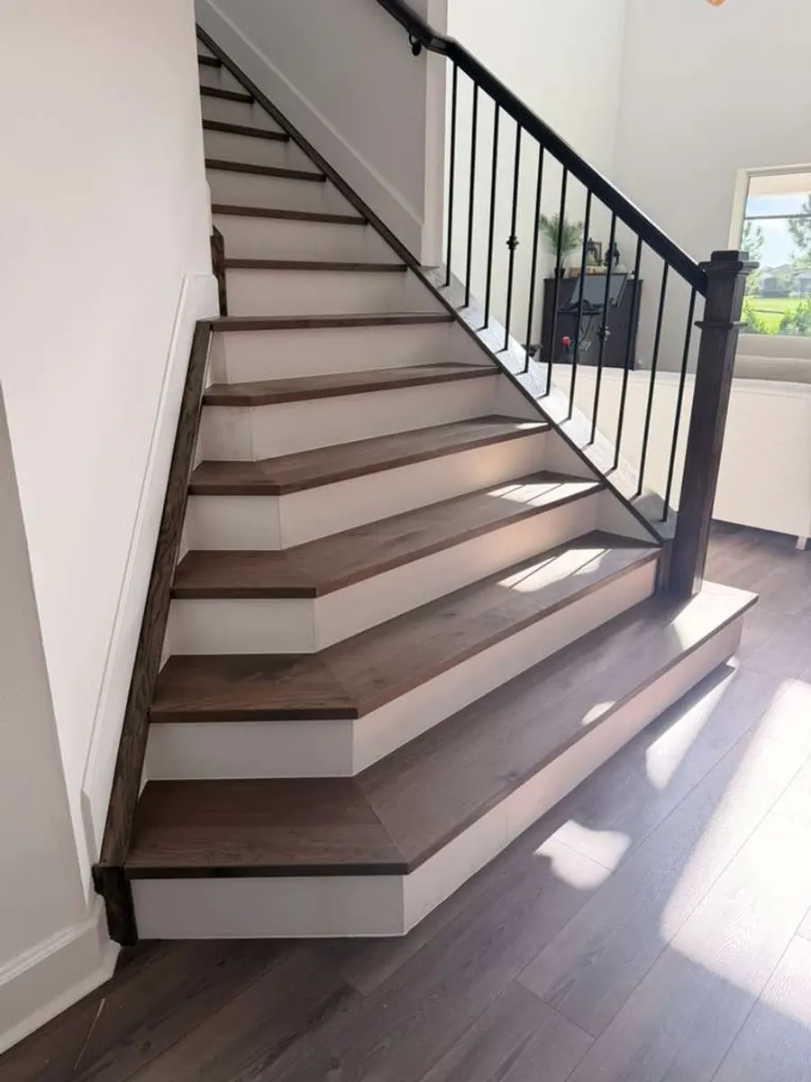 Staircase with two-tone wood treads and risers