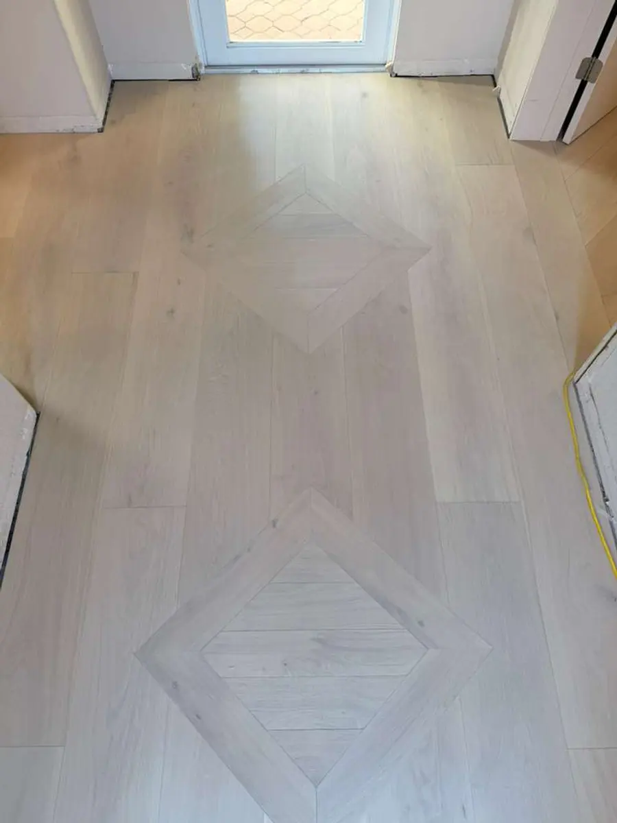 Herringbone pattern flooring, light finish