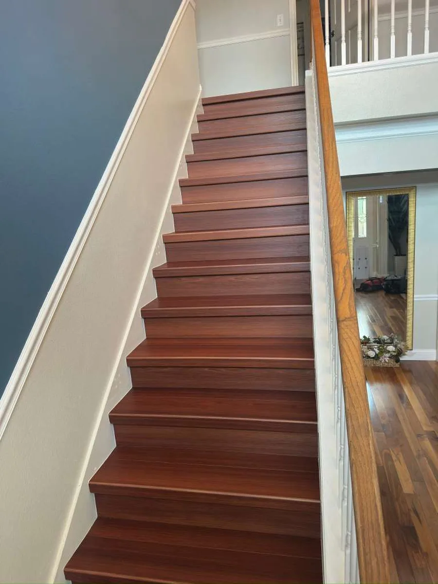 Staircase finished with deep cherry-tone treads