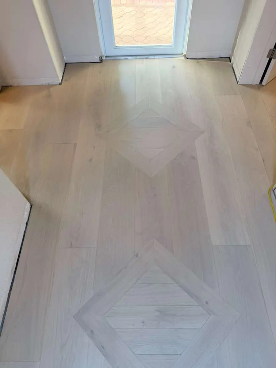 Herringbone pattern flooring, light finish