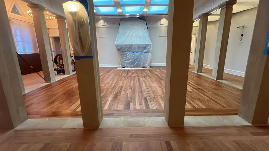 Close-up of a freshly sanded and stained hardwood floor corner